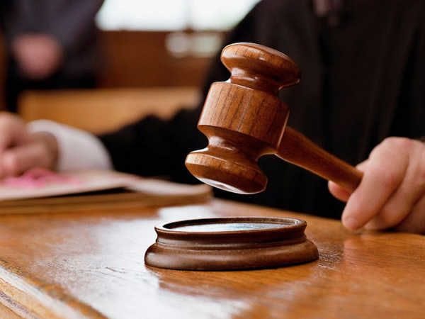 Merely moving hand over back and head of minor girl without sexual intent does not amount to ___