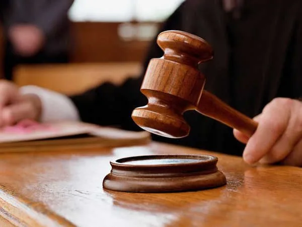 Merely moving hand over back and head of minor girl without sexual intent does not amount to ___